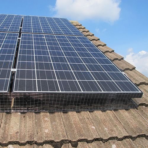 Protective mesh fitted around solar panels